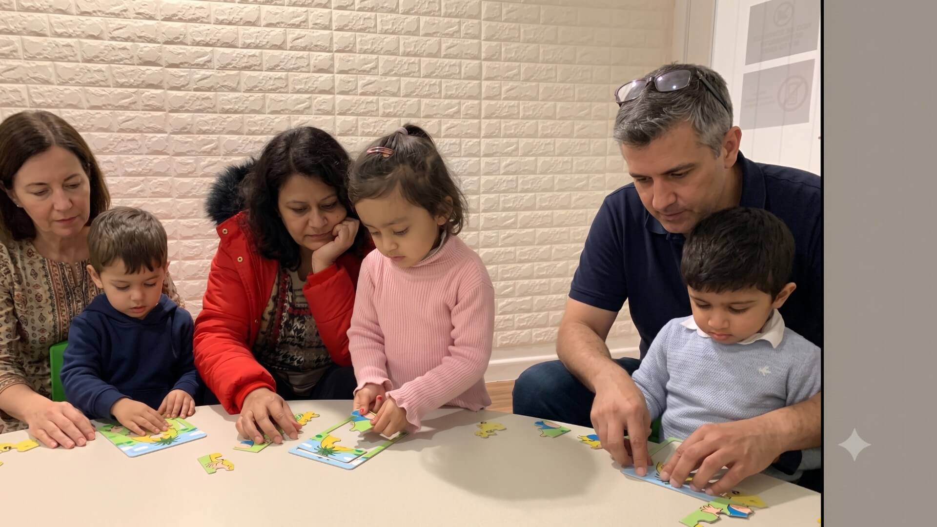 Preschool child solving a spatial puzzle alongside their parent in a Shichida session